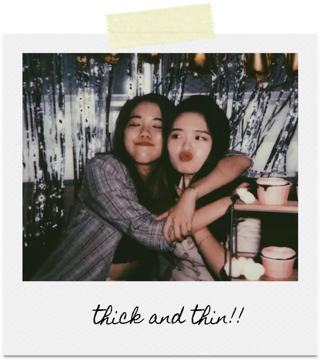 Two friends embracing at a celebration, captioned thick and thin!!