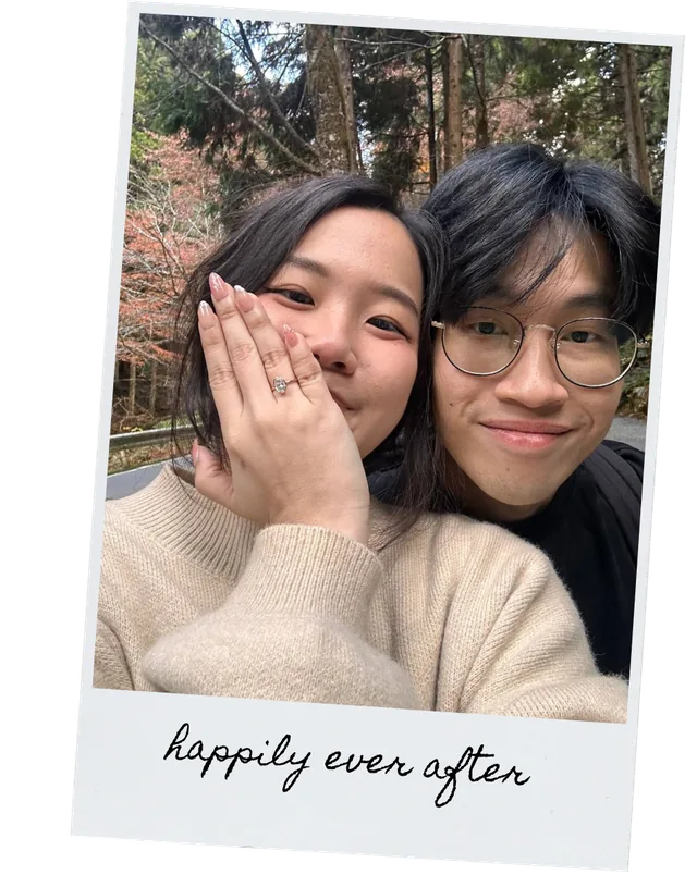 Tracy and Xuan Le showing an engagement ring, captioned happily ever after