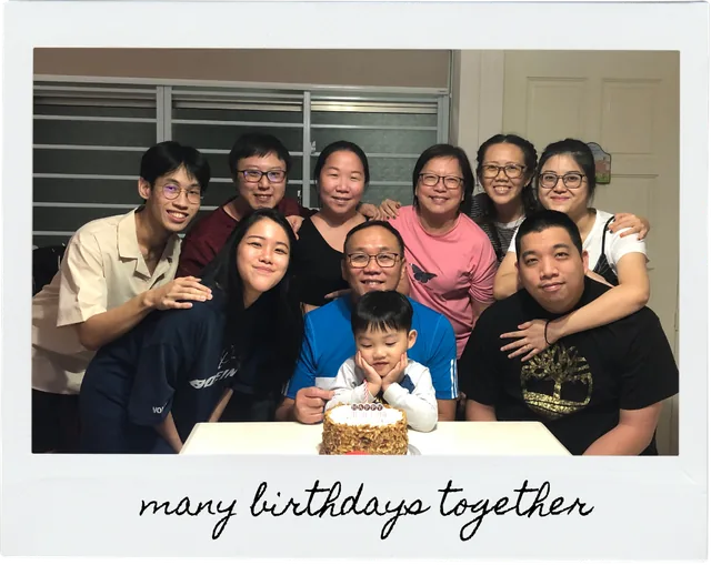 A family birthday gathering around a cake, captioned many birthdays together